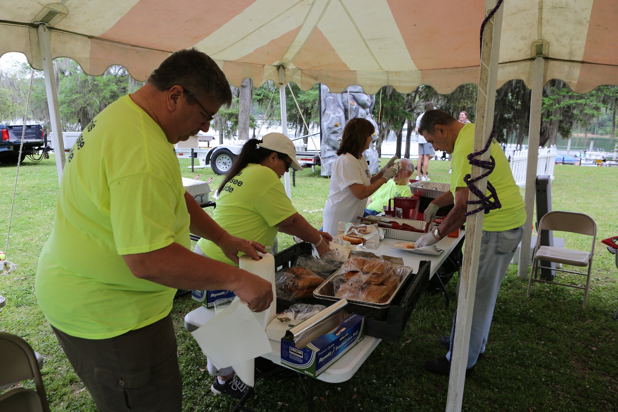 volunteers preparing hotdogs and food 