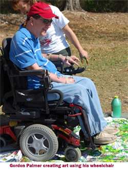 Gordion Palmer creating art using his wheelchair