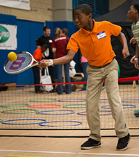 athlete with a disability playing tennis